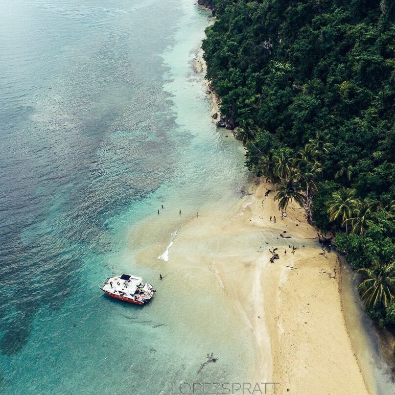 Jackson Bay coastline Aerial view of a secluded beach and boat at Jackson Bay