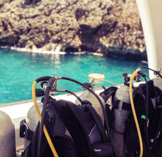 Scuba tanks and diving equipment prepared aboard the boat at Cabo Cabrón