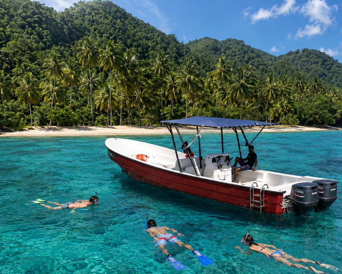 Snorkelers swimming beside the Latif twin-engine speedboat at Jackson Bay